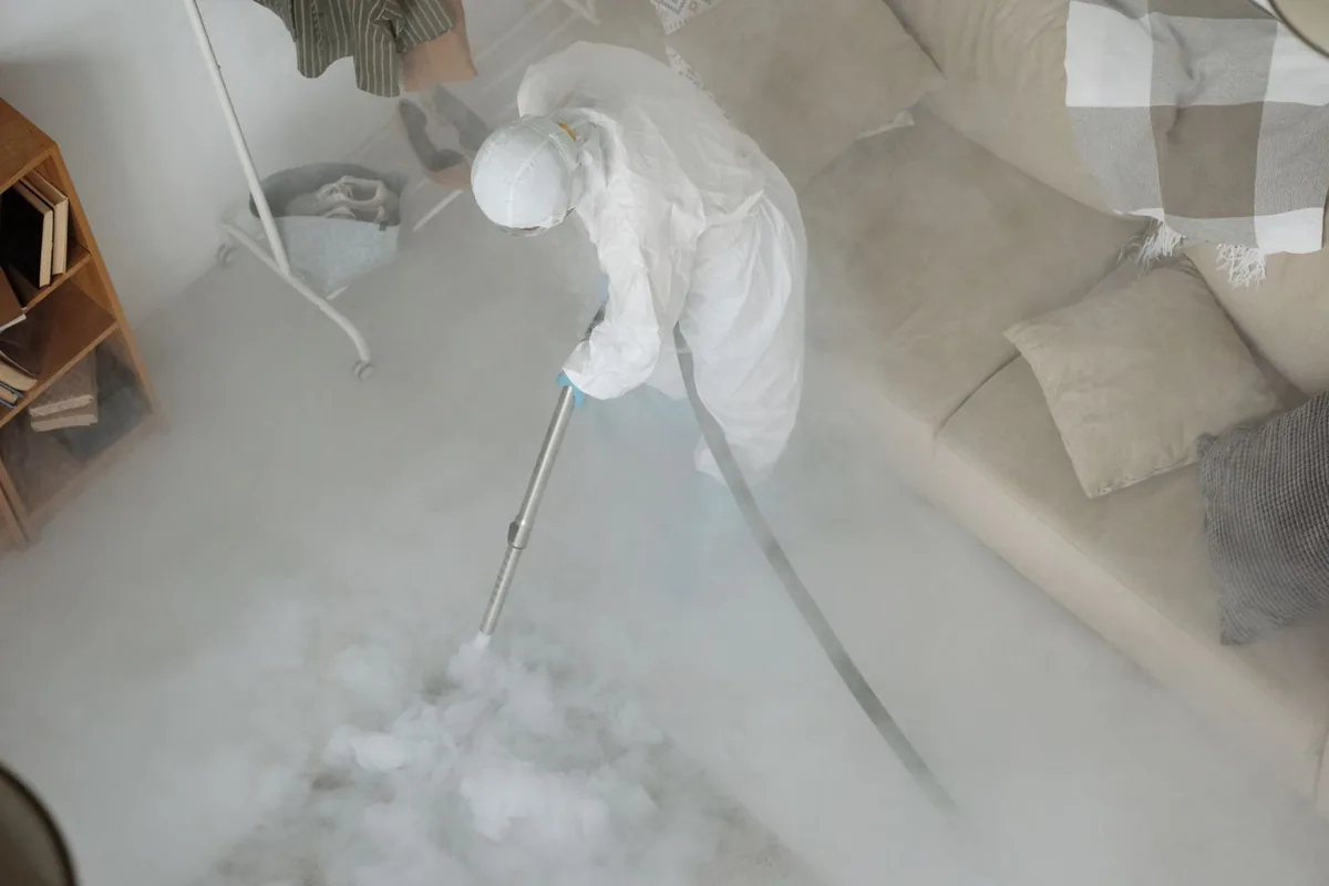 Biohazard cleanup technician in protective equipment, Independence, KS